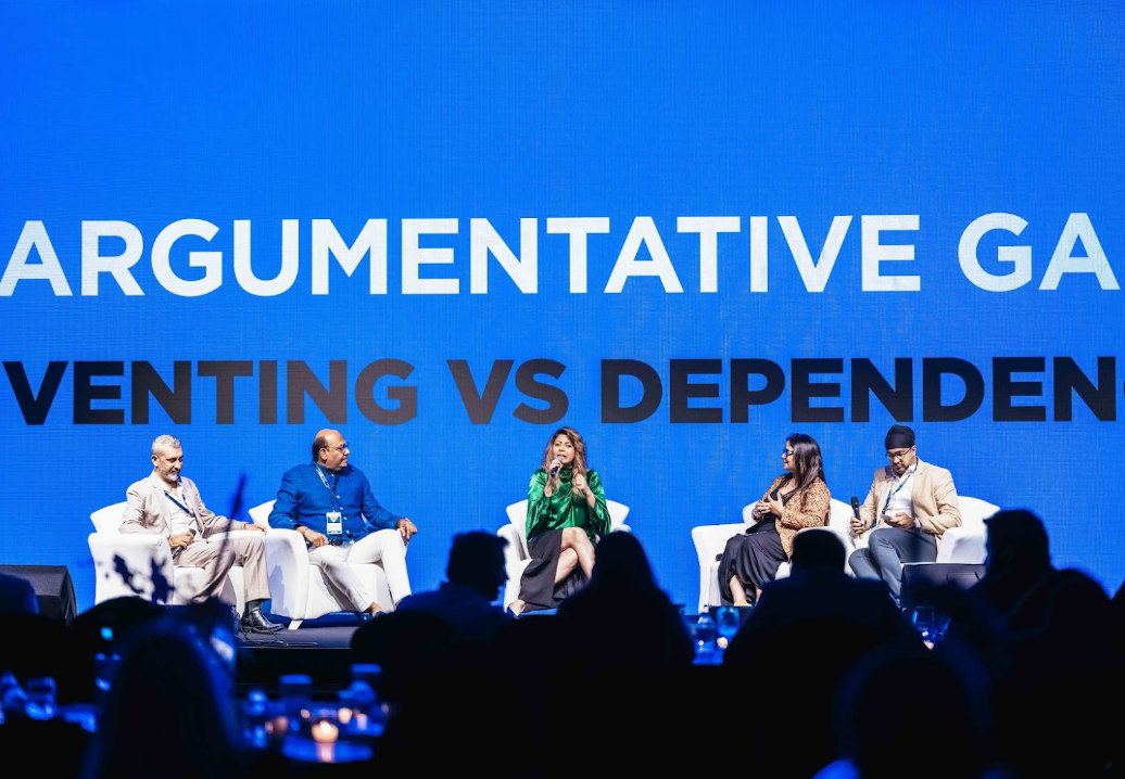 Panel of speakers on stage