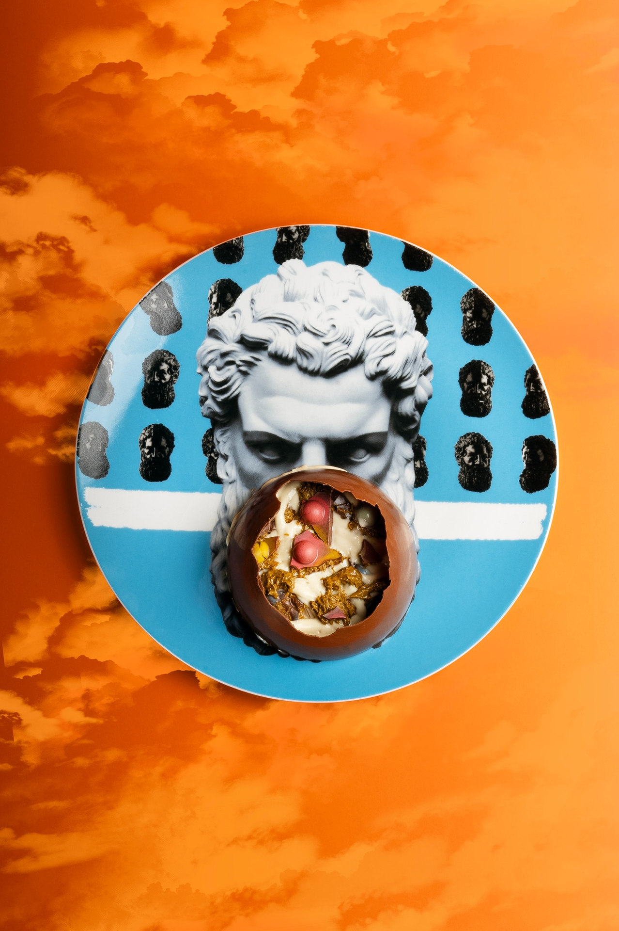 Stylized plated dessert on orange background