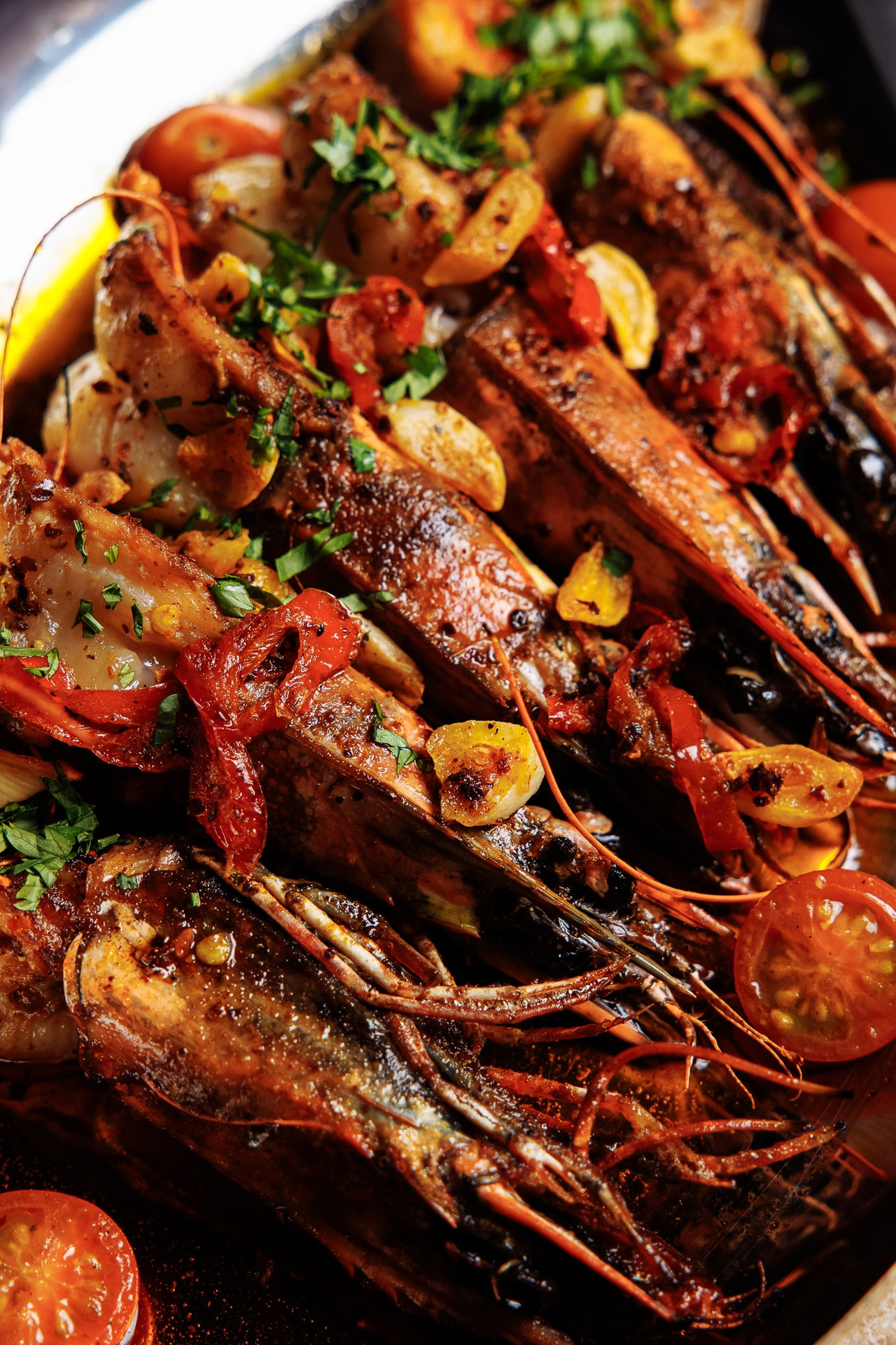 Close-up of prawns and seafood with herbs