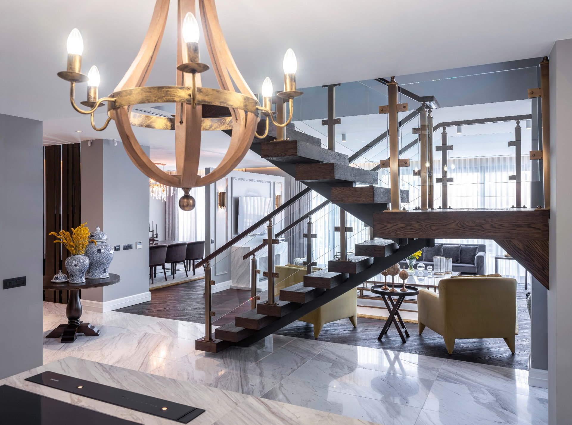 Contemporary residence with double-height space and floating wooden staircase