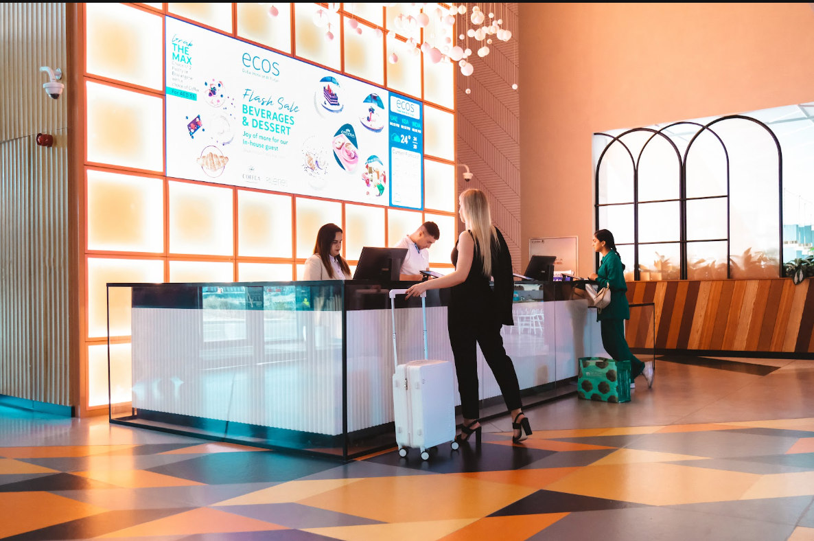 Reception welcoming guests in hotel lobby